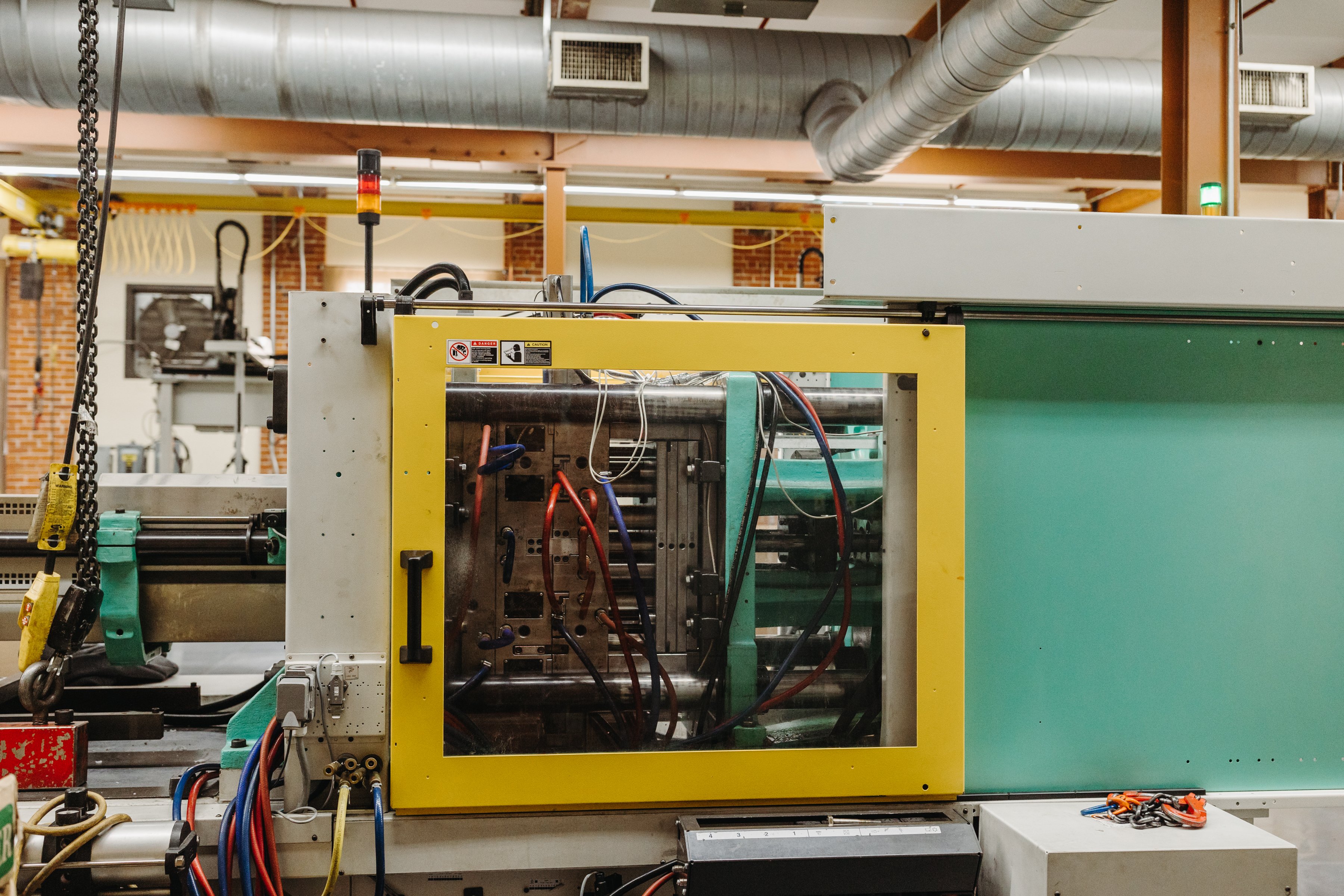 Close up of an injection molding machine that produces sensors