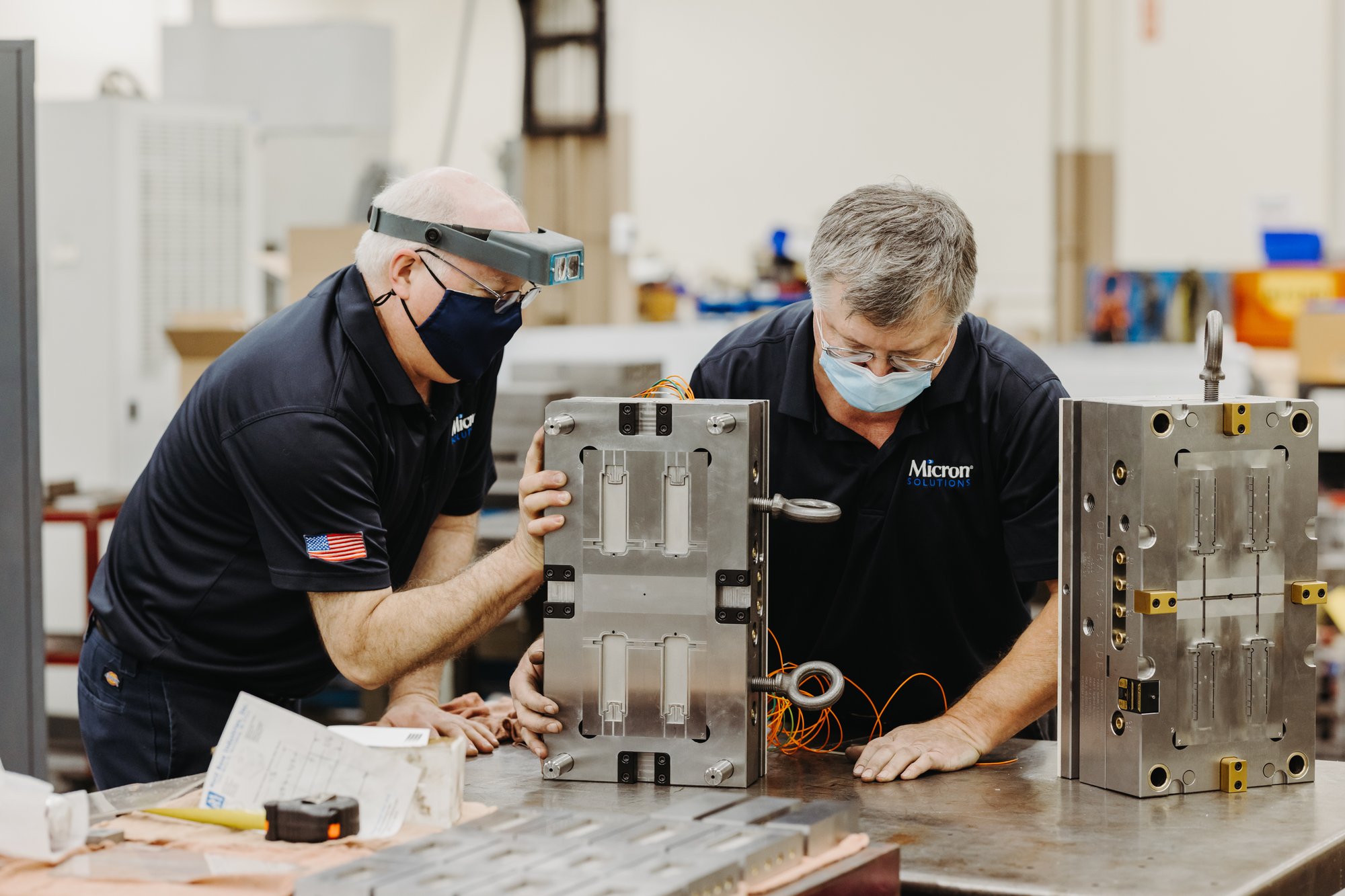Two Micron employees working together to ensure precision, quality, and accuracy