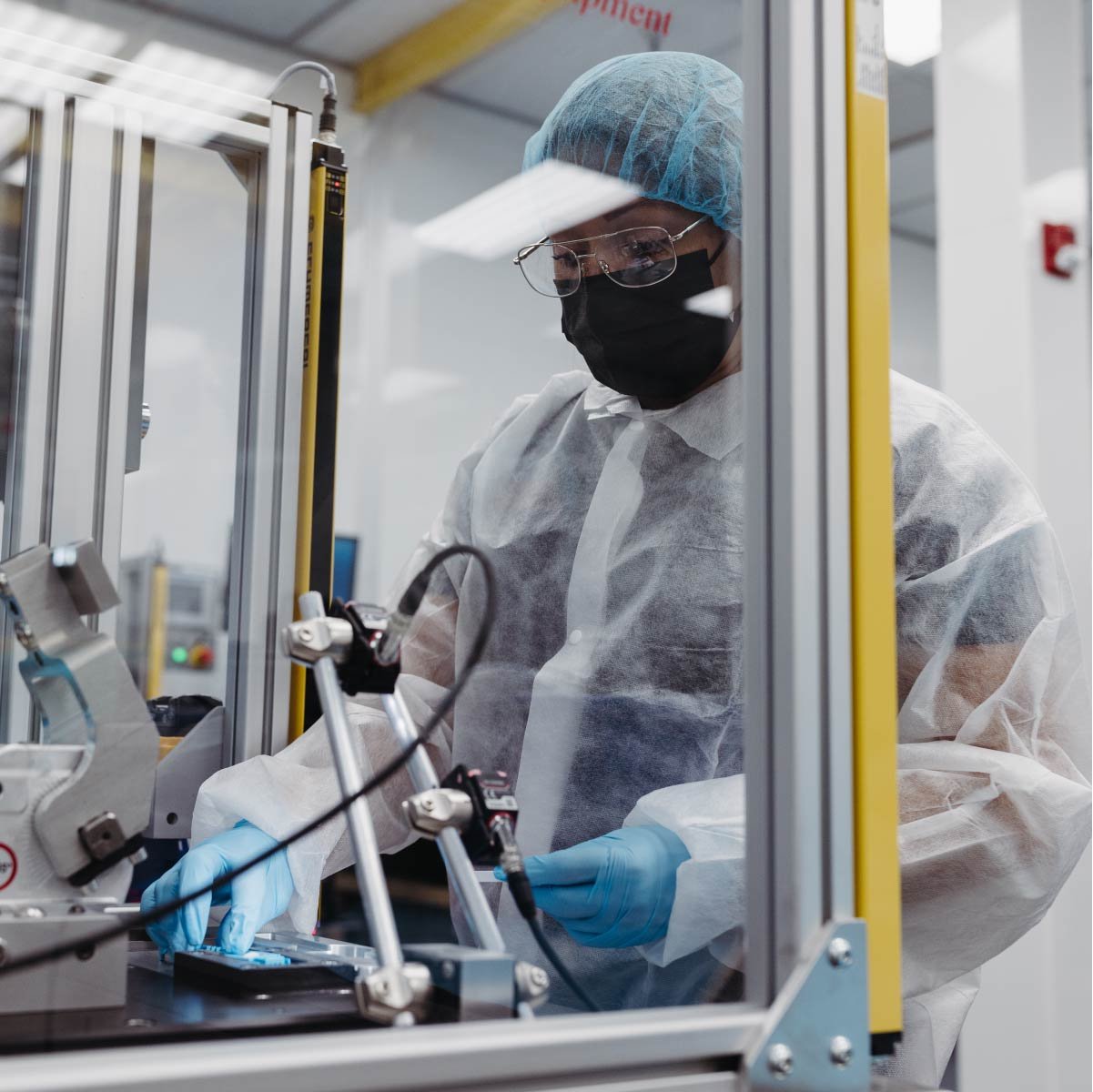 A Micron employee working in a cleanroom