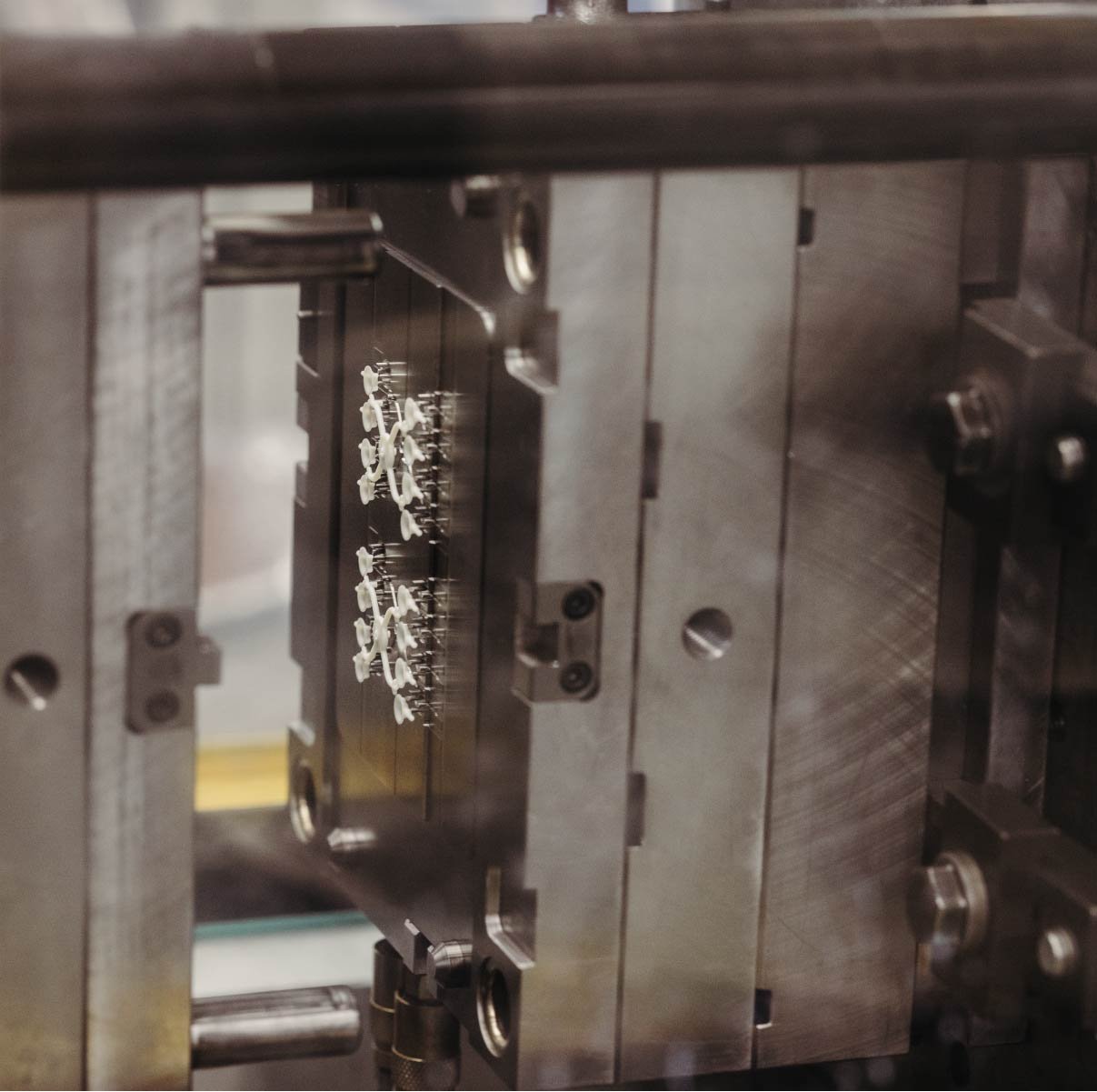 Looking into the machine at sensors being manufactured