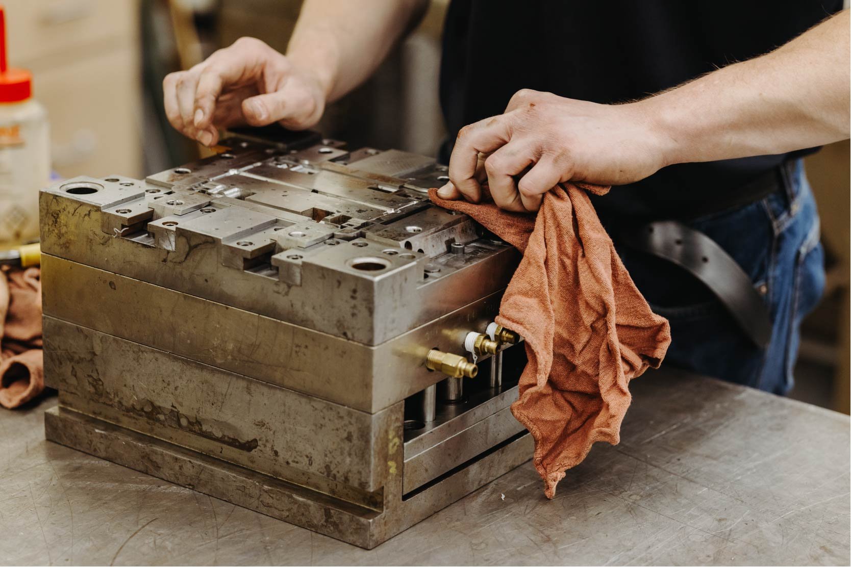 Man polishing thermoplastic mold