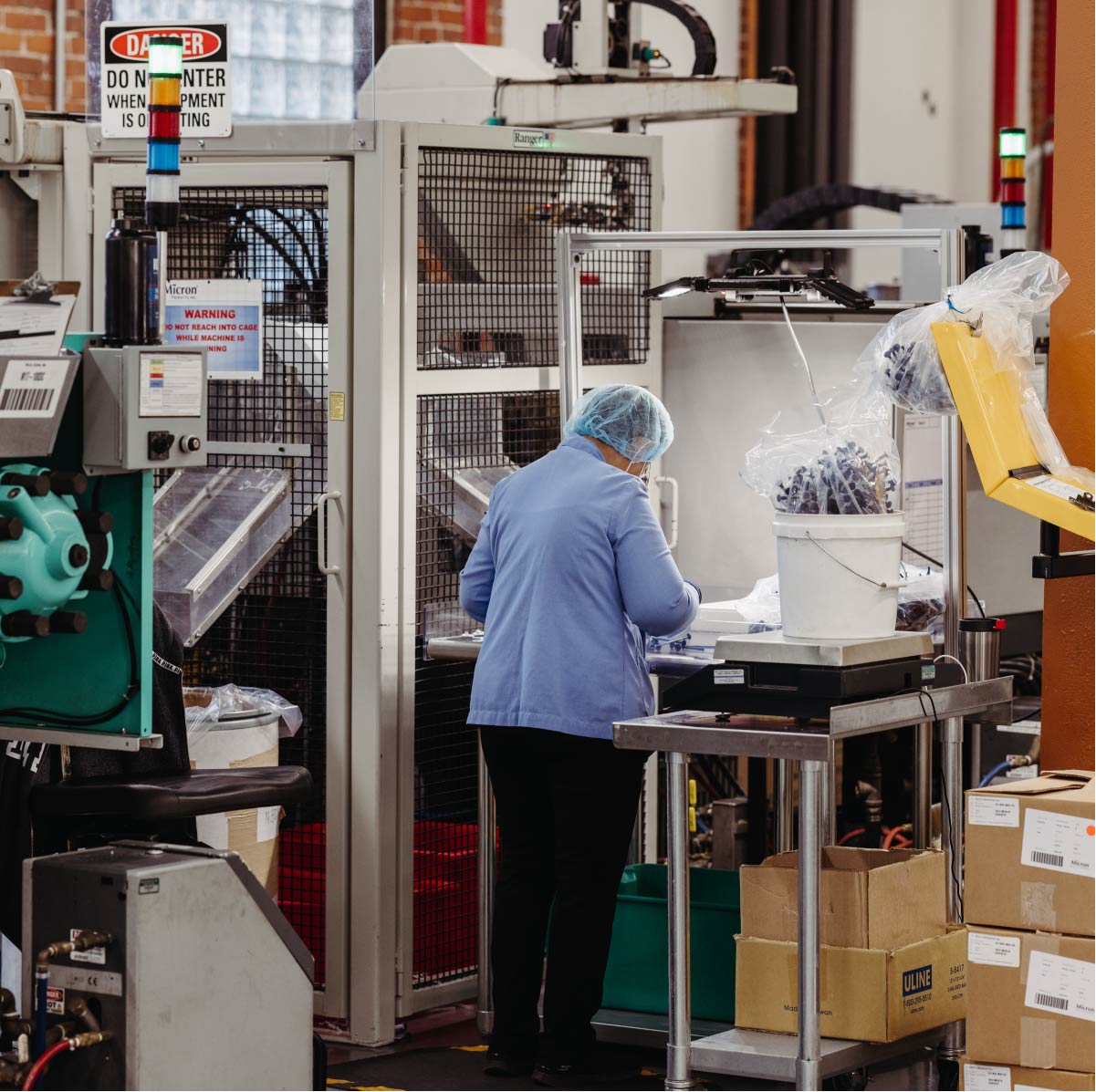 An employee works on assembling medical devices