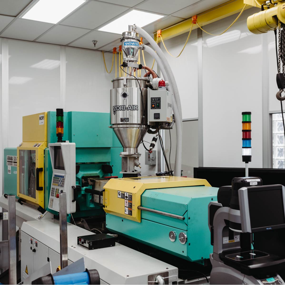 An Arburg injection molding machine with a Dri-Air attachment