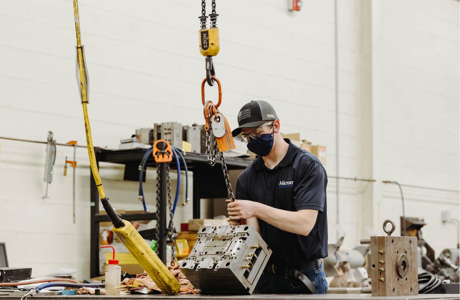 An employee working with one of the molds